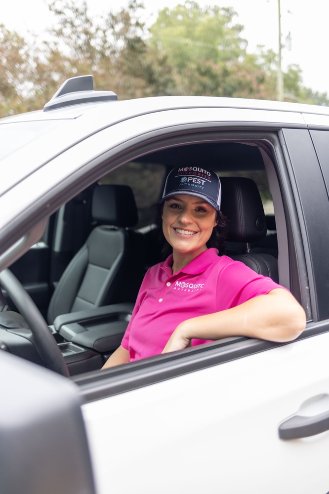 A Mosquito Authority franchise owner behind the wheel of a truck.